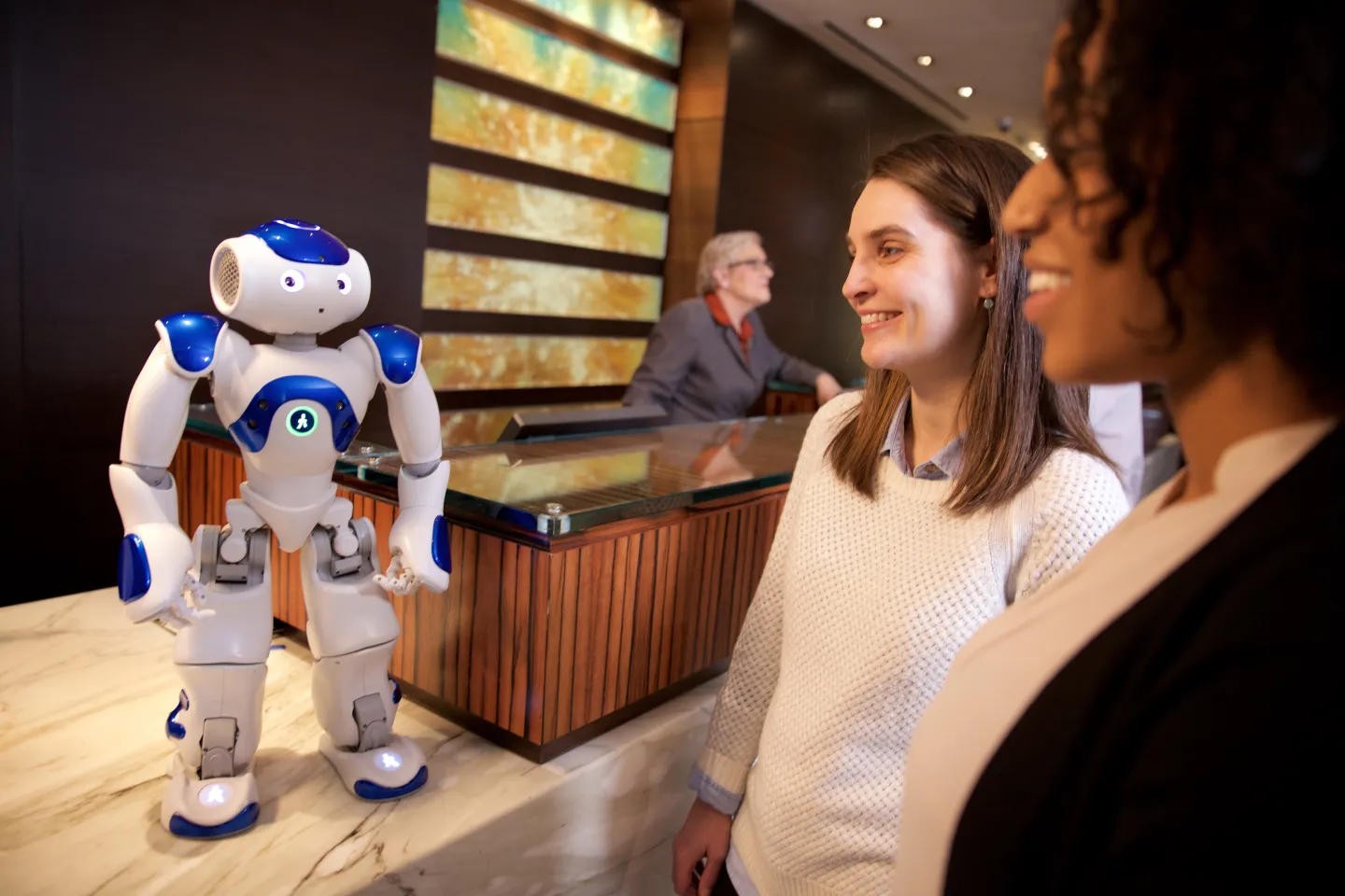 Some guests at Hilton chatting with the IBM Watson robot